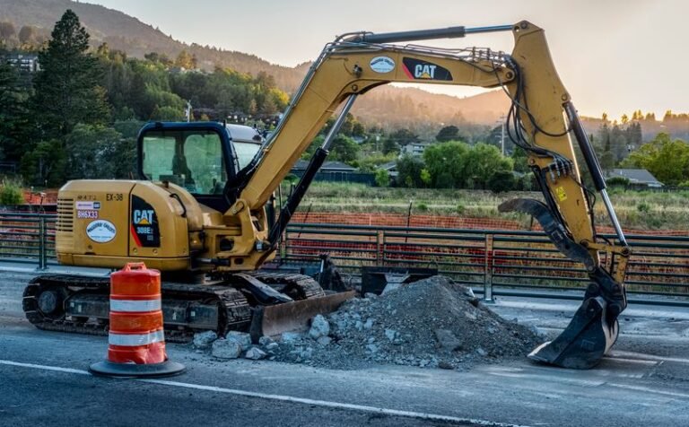 Excavator at road repair and maintenance project Dubai
